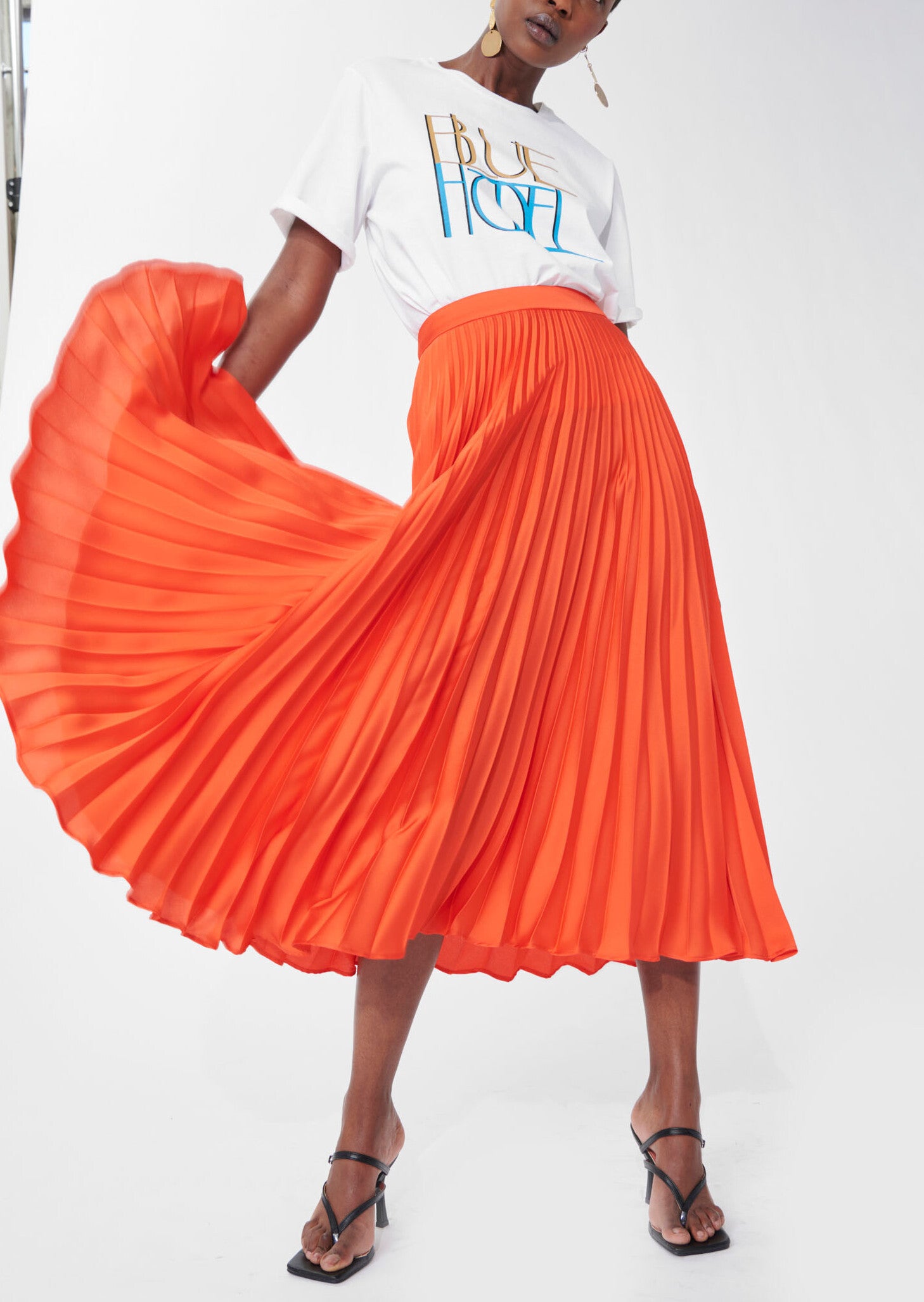 Jupe Juline orange en satin plissé Faume - seconde main